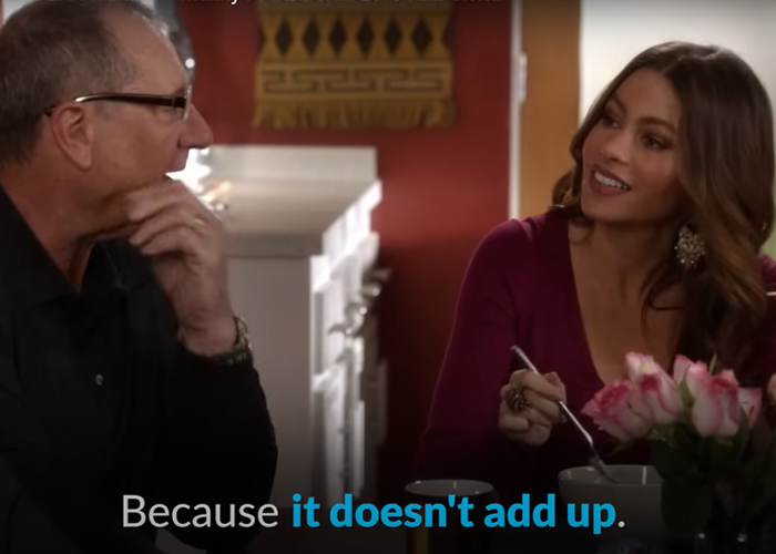 "Jay and Gloria discussing at the dinner table in Modern Family."