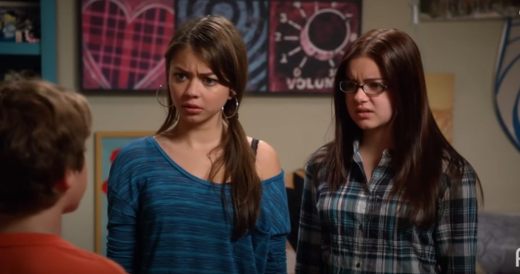"Haley and Alex reacting humorously in a scene from Modern Family."