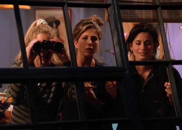 "Monica, Rachel, and Phoebe looking through a window with binoculars in hand, spying on George Stephanopoulos."