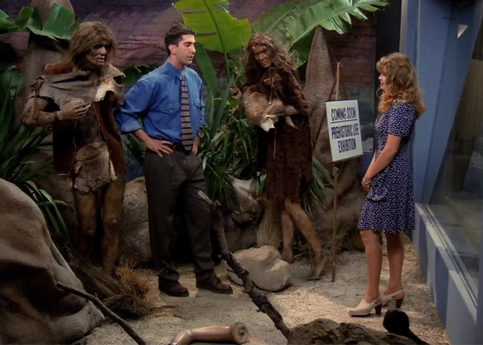 "Ross and Marsha setting up the prehistoric exhibit – a humorous take on early human challenges!"