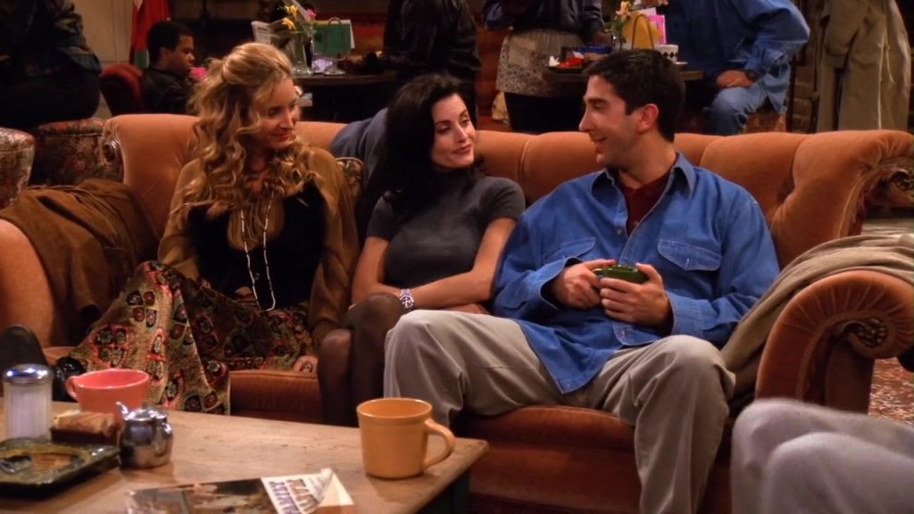 "Phoebe, Monica, and Ross sitting on the Central Perk couch in Friends Season 1 Episode 6."