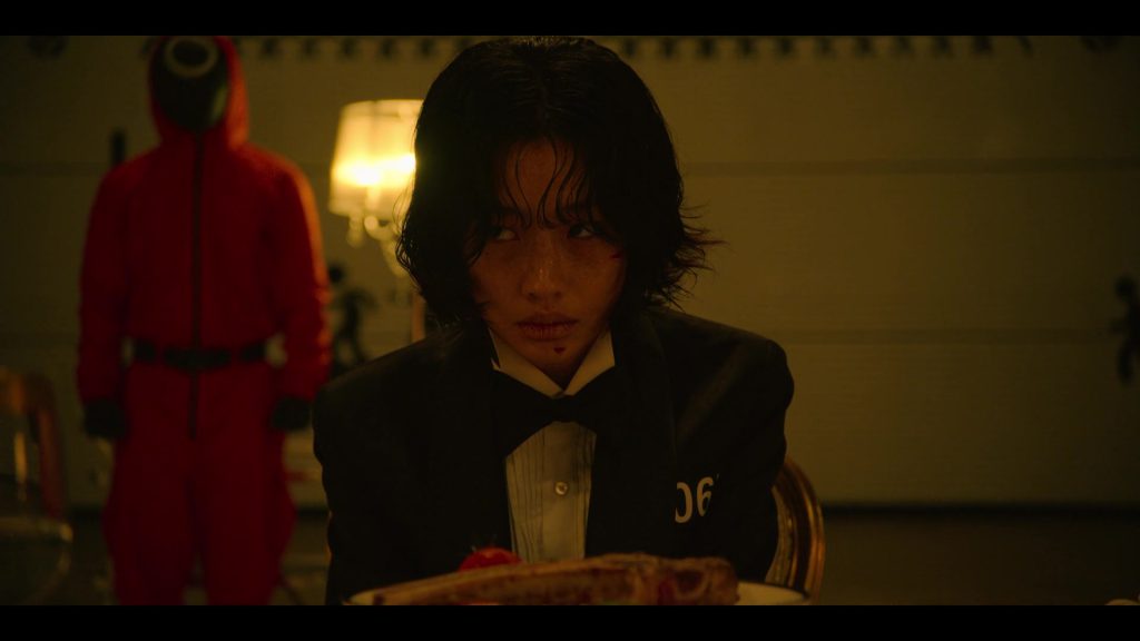 Player 067 at the final feast in Squid Game Episode 8.