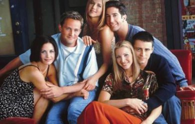 The six main cast members of Friends sitting together in a group pose.