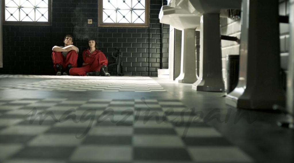 wo Money Heist characters in a reflective moment, ideal for language learning with Netflix subtitles.
