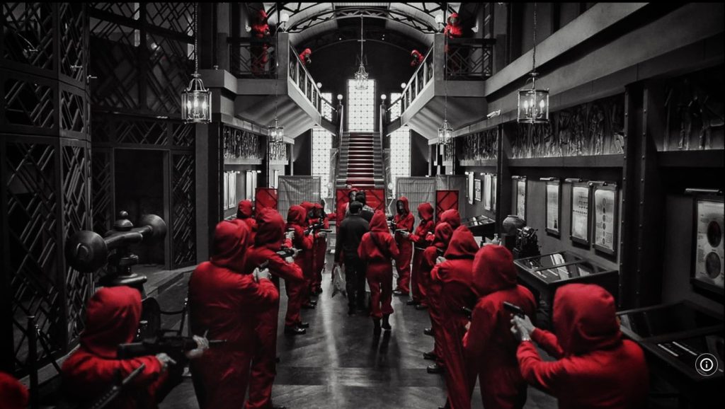 Red jumpsuit robbers in Money Heist for language learning with Netflix.