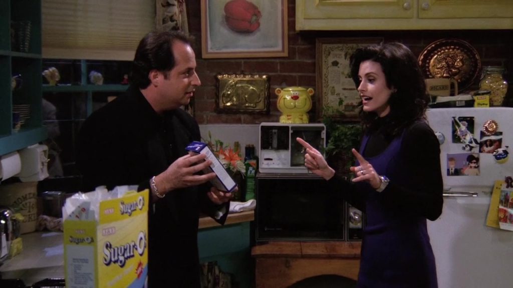 Monica and Steve discussing dinner preparations in Friends S01 E15