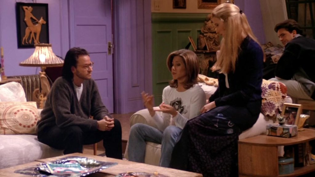 Learn English with Netflix - Phoebe and Roger Vocabulary Phoebe lying on Roger’s lap on the Central Perk couch in Friends S01 E13.