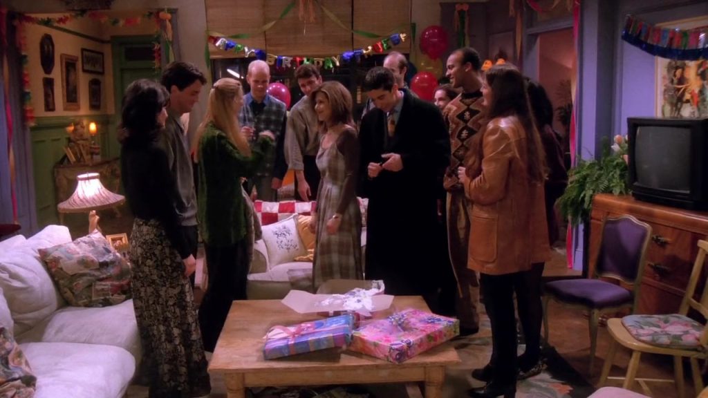 Group celebrating Phoebe's birthday party in Friends S01E17
