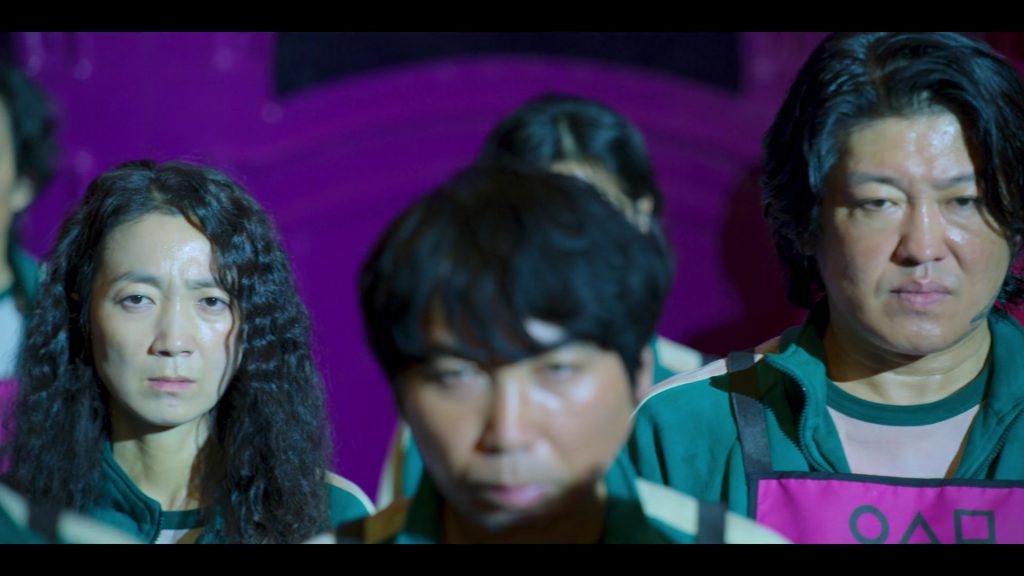 Contestants looking stressed during challenges in Squad Game Episode 7.
