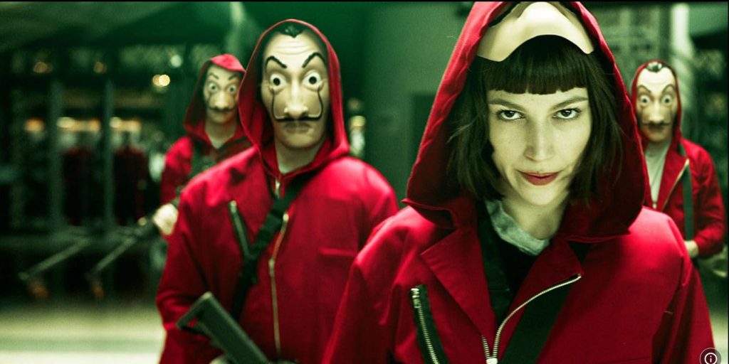 Movie vocabulary learning with Money Heist's red outfits and Dali masks.