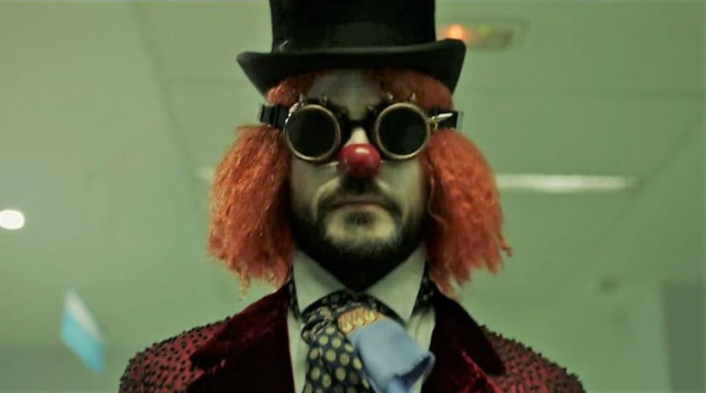 A character in a clown costume with a top hat and goggles from Money Heist, exuding mystery and creativity.