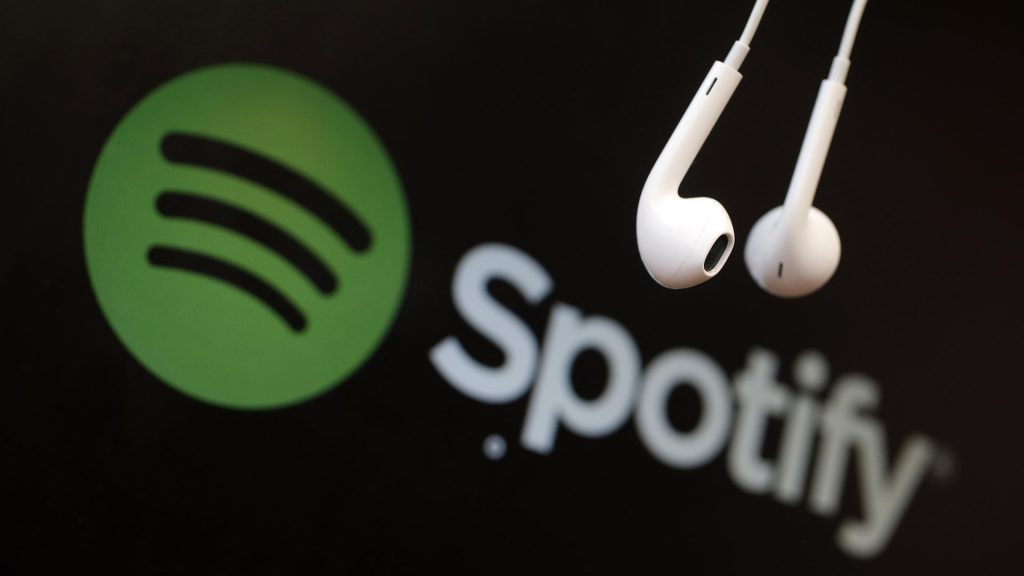 Spotify logo with headphones, representing language learning through podcasts.