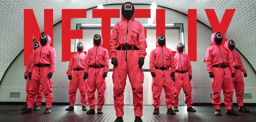 Squid Game guards lined up in their iconic pink uniforms.