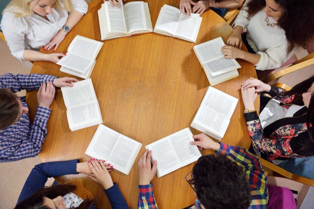 Students learning English together in a classroom.