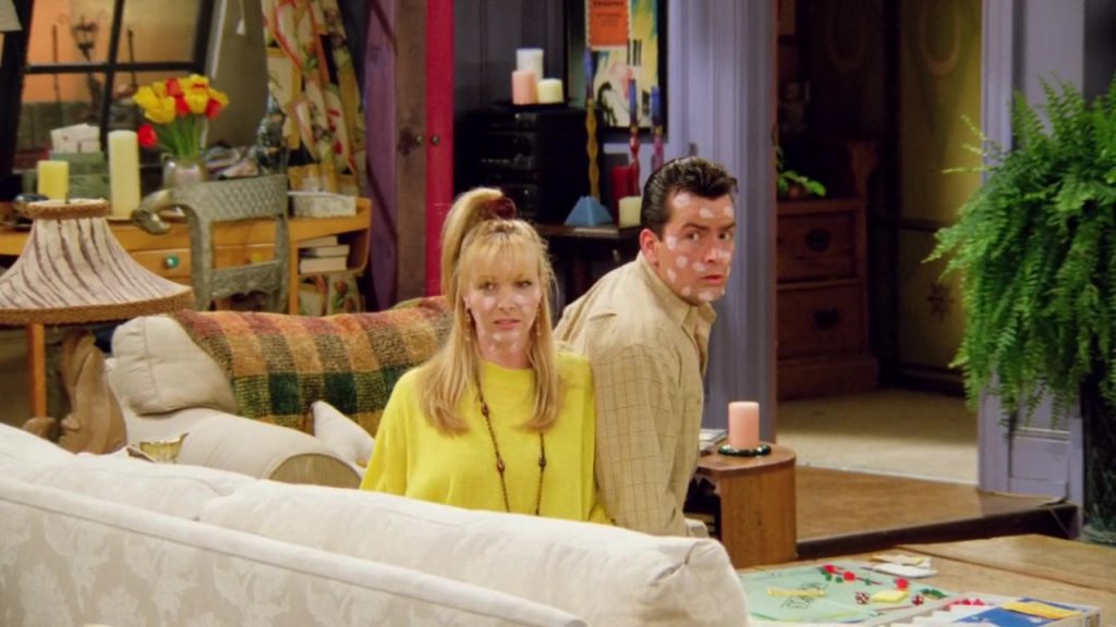 "Learning English through TV series scene with characters sitting on a couch"