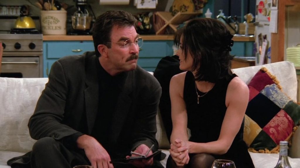 Learning English with Friends Monica Richard Dialogue Scene Monica and Dr. Richard Burke from Friends S02E15 discussing in a cozy apartment setting, perfect for learning English with Friends.