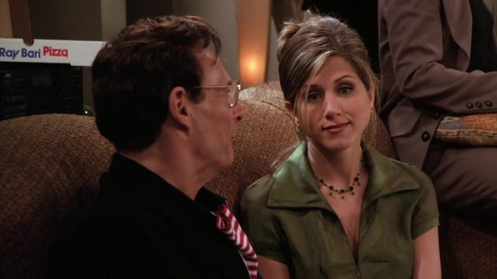 Rachel sharing a heartfelt moment with her dad at her birthday party in Friends S02E22. A scene full of rich vocabulary and emotional depth.