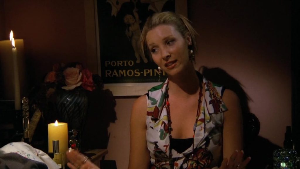 Phoebe sitting with candles, sharing wisdom in Friends Series