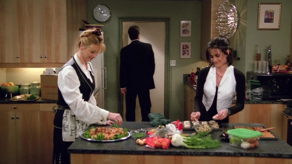 Learning English with Friends Monica Phoebe Waitressing Vocabulary Monica and Phoebe working in a kitchen from Friends S02E15, a playful scene for learning vocabulary about waitressing and teamwork.