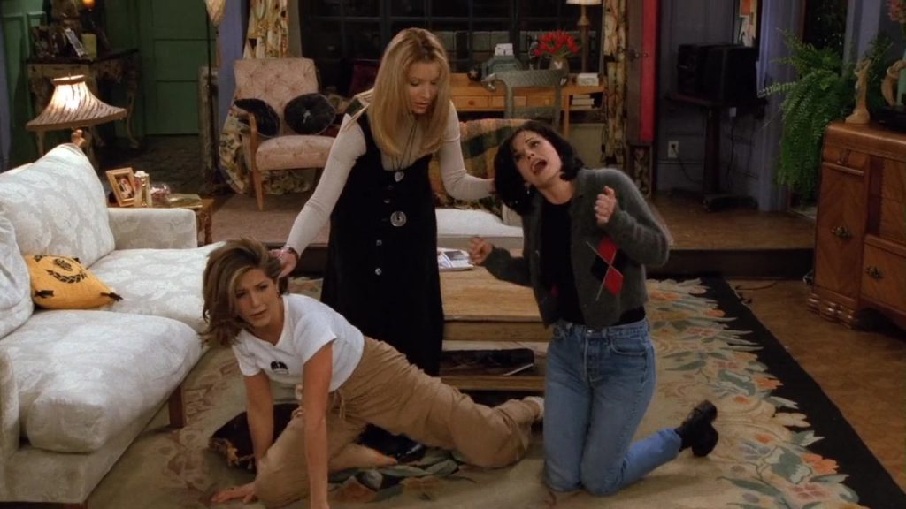 "Monica, Rachel, and Phoebe in a humorous living room scene from Friends S02E13, ideal for Netflix Learning English."