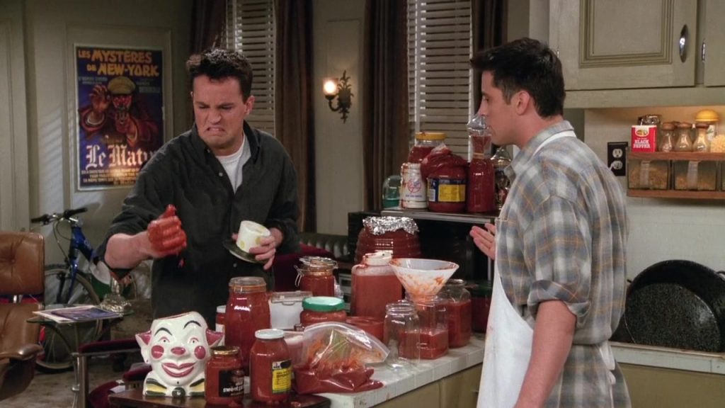 Chandler and Joey in the kitchen, a humorous moment ideal for film language study.