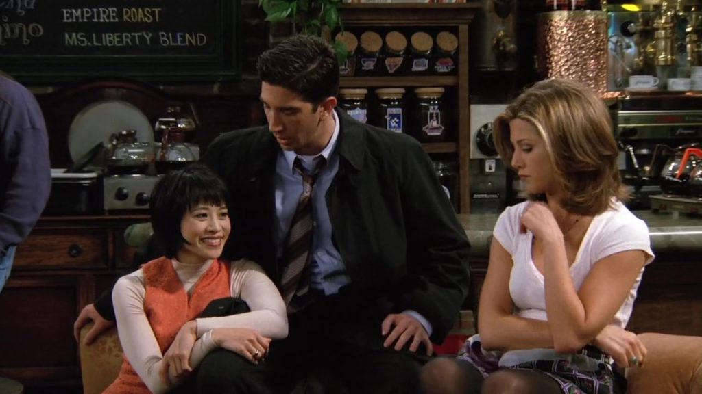 Scene from Friends S02E08 featuring Ross, Rachel, and another character at Central Perk – perfect for cinema language learning