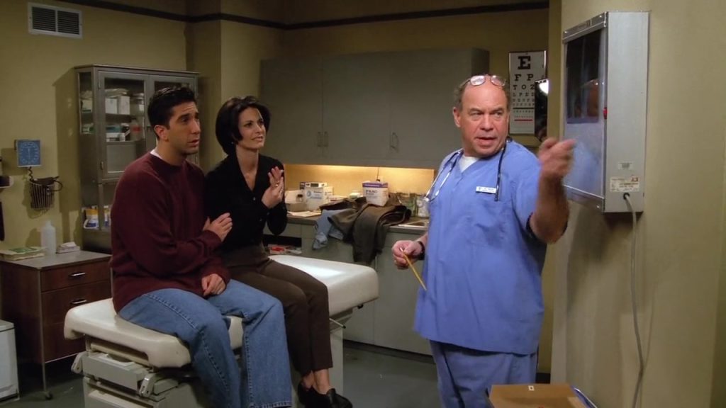  Ross and Monica sitting with a doctor at a hospital in Friends S02E06