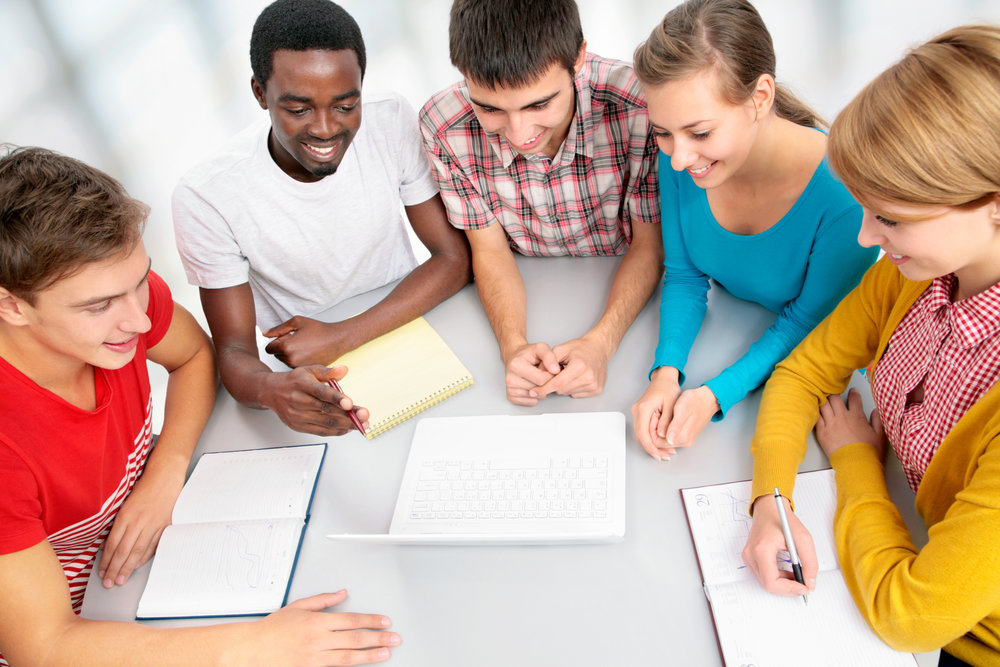 Students learning English together in a classroom.