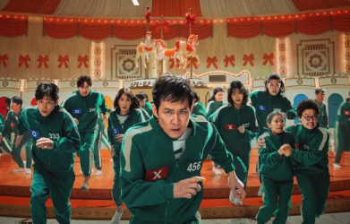 Squid Game Season 2 poster featuring players in green tracksuits – ideal for language learning with Netflix.