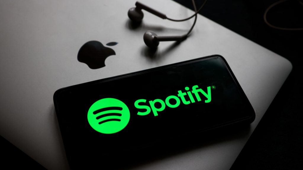 "Spotify logo displayed on a smartphone, perfect for language learning with Spotify and podcasts."
