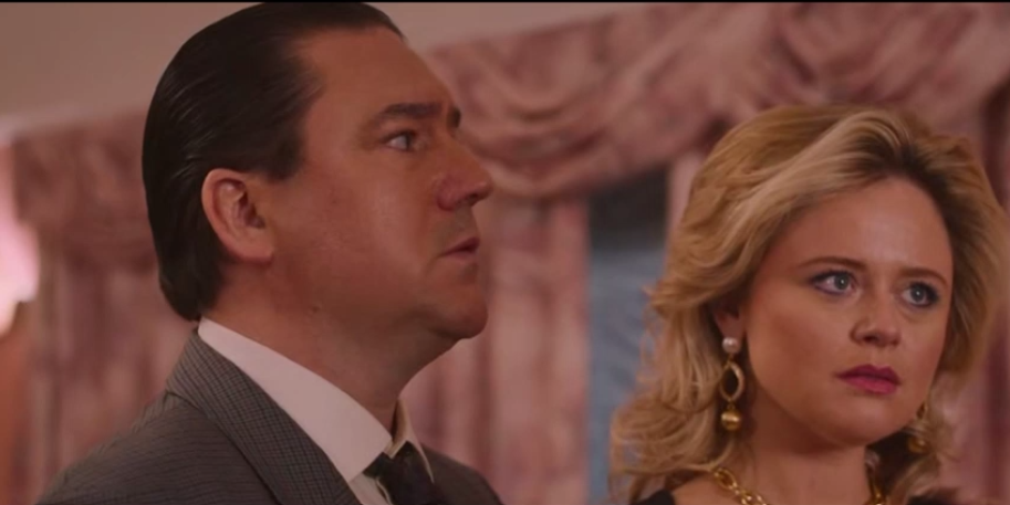 A couple discussing intensely in a formal setting, from Rival S01E02