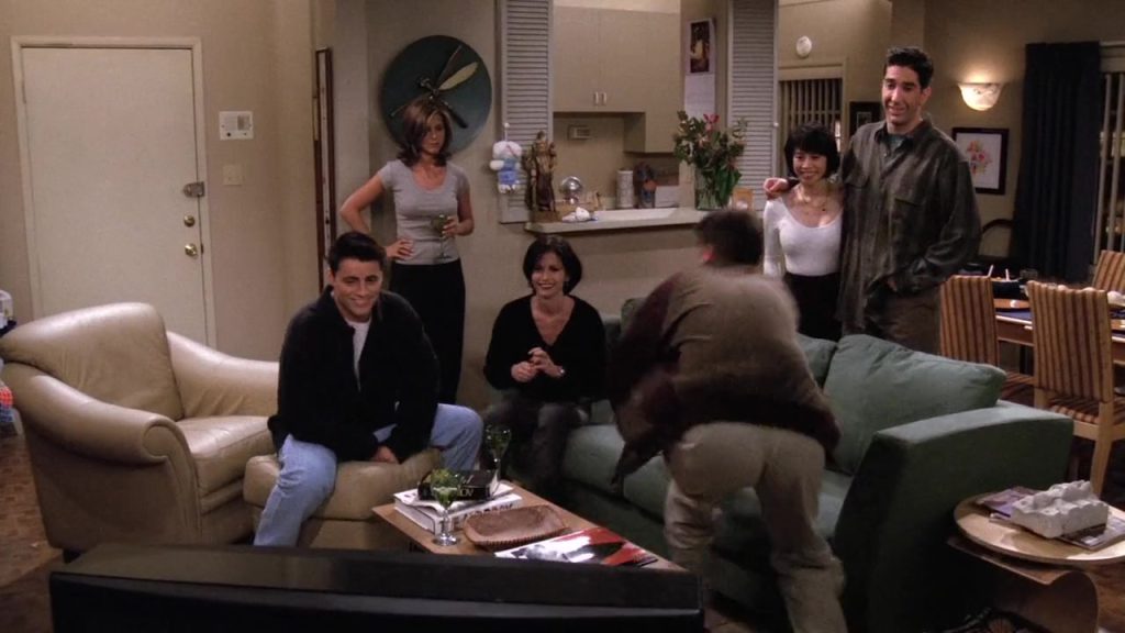 Friends cast watching a movie for language learning and entertainment