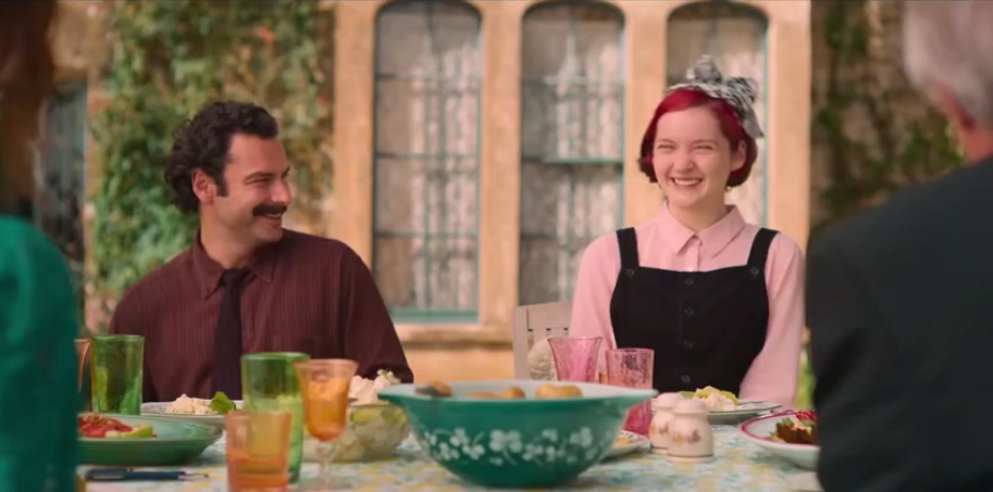 Friends sharing a laugh during an outdoor lunch – Language Learning With Disney